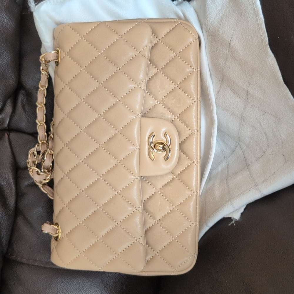 CHANEL Beige Quilted Leather Flap Bag